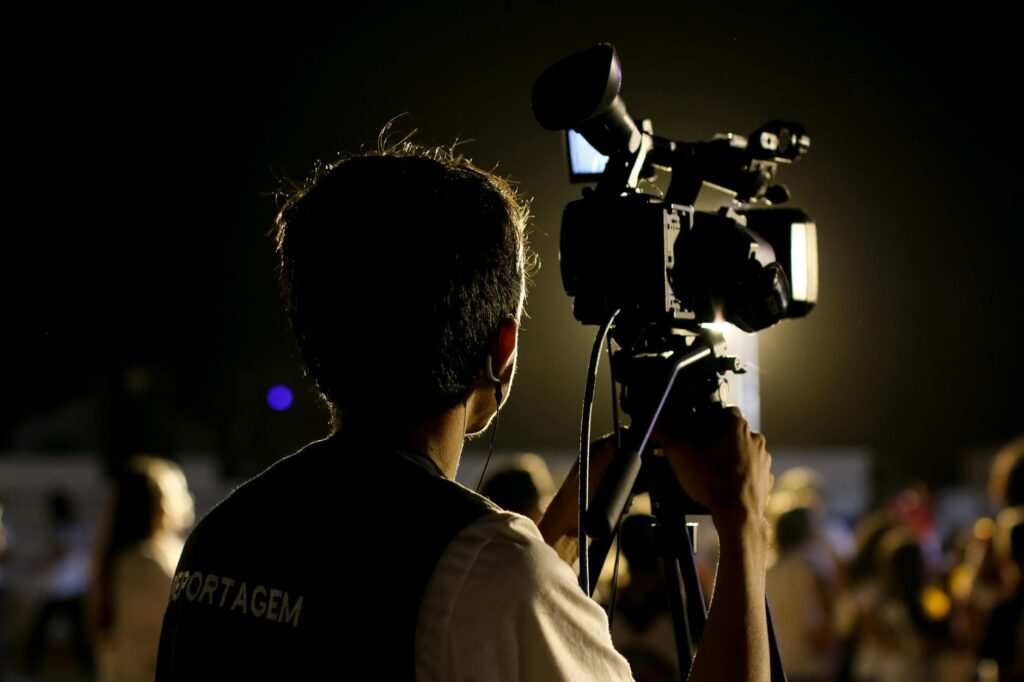 shallow focus photo of cameraman
